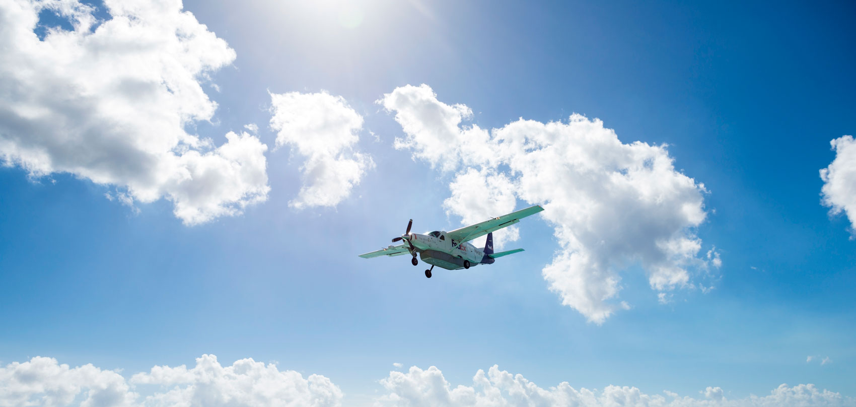 An exports plane flying in the sky.